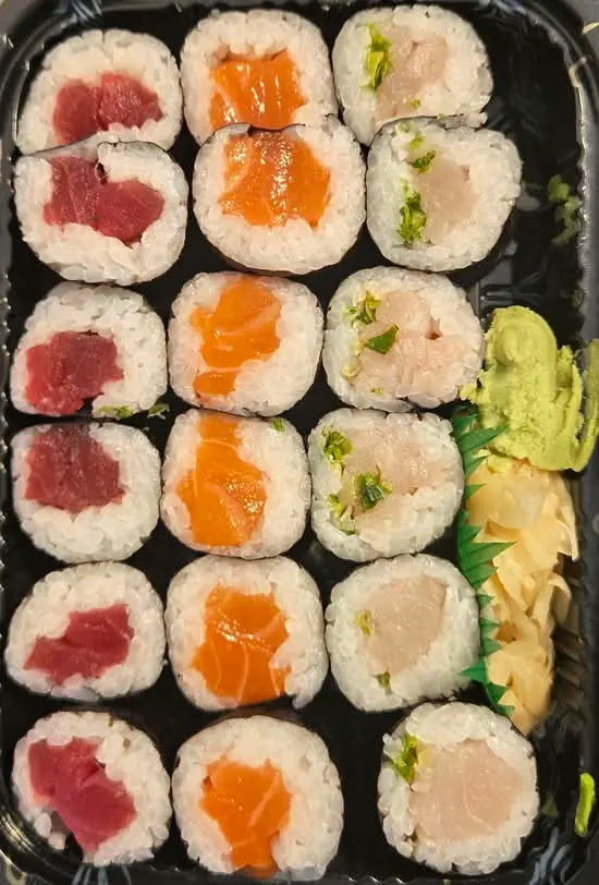 Salmon and tuna maki on a black tray at Abis in Greenwich